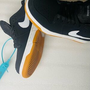 Nike Black and White Sneakers with Orange Sole